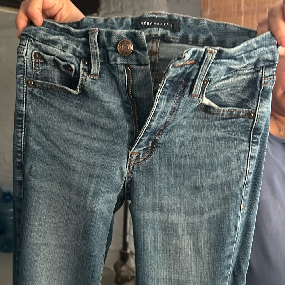 A jeans size 0 has been worn